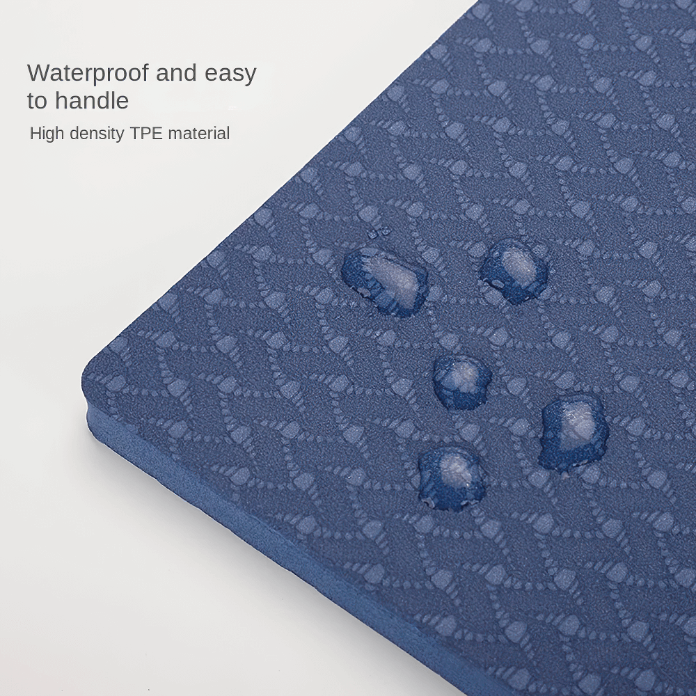 Close-up of waterproof embossed yoga mat with water droplets highlighting high-density TPE material.