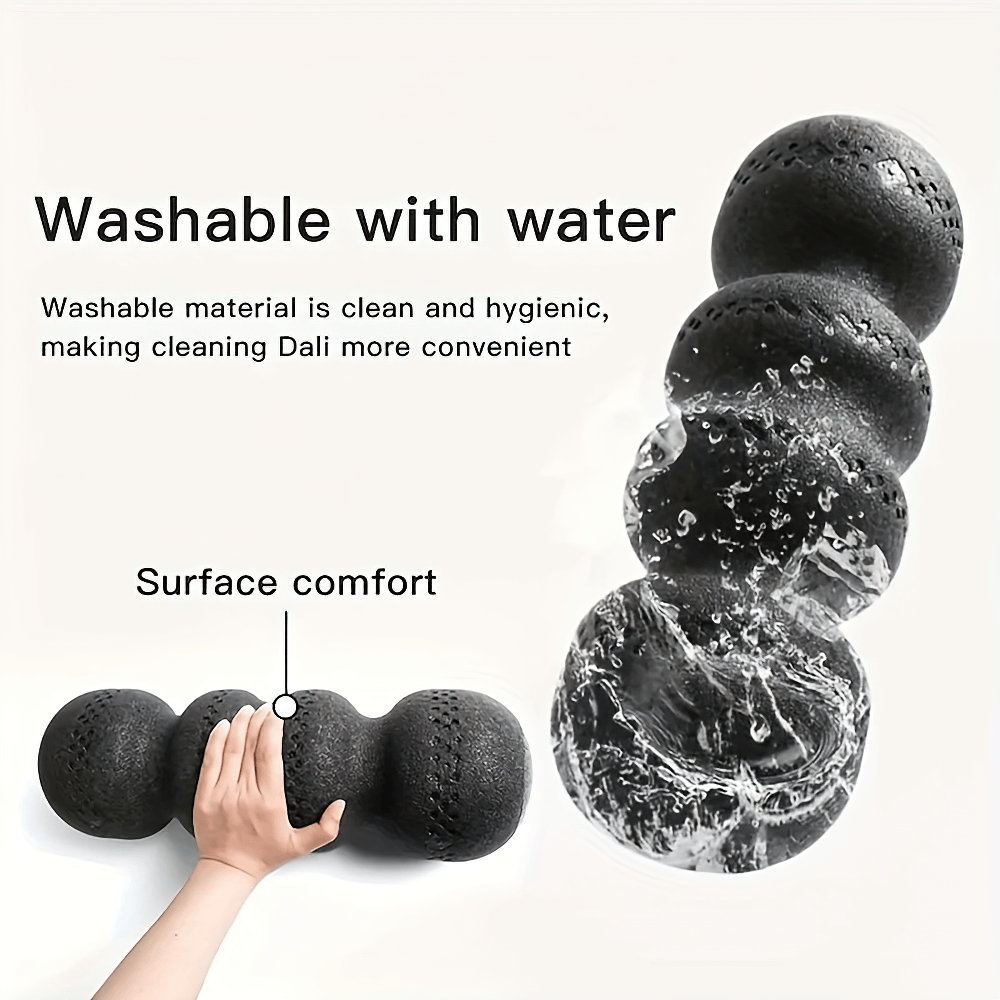 EPP deep tissue peanut massage roller being washed, showcasing its washable surface and ergonomic design for muscle relief.