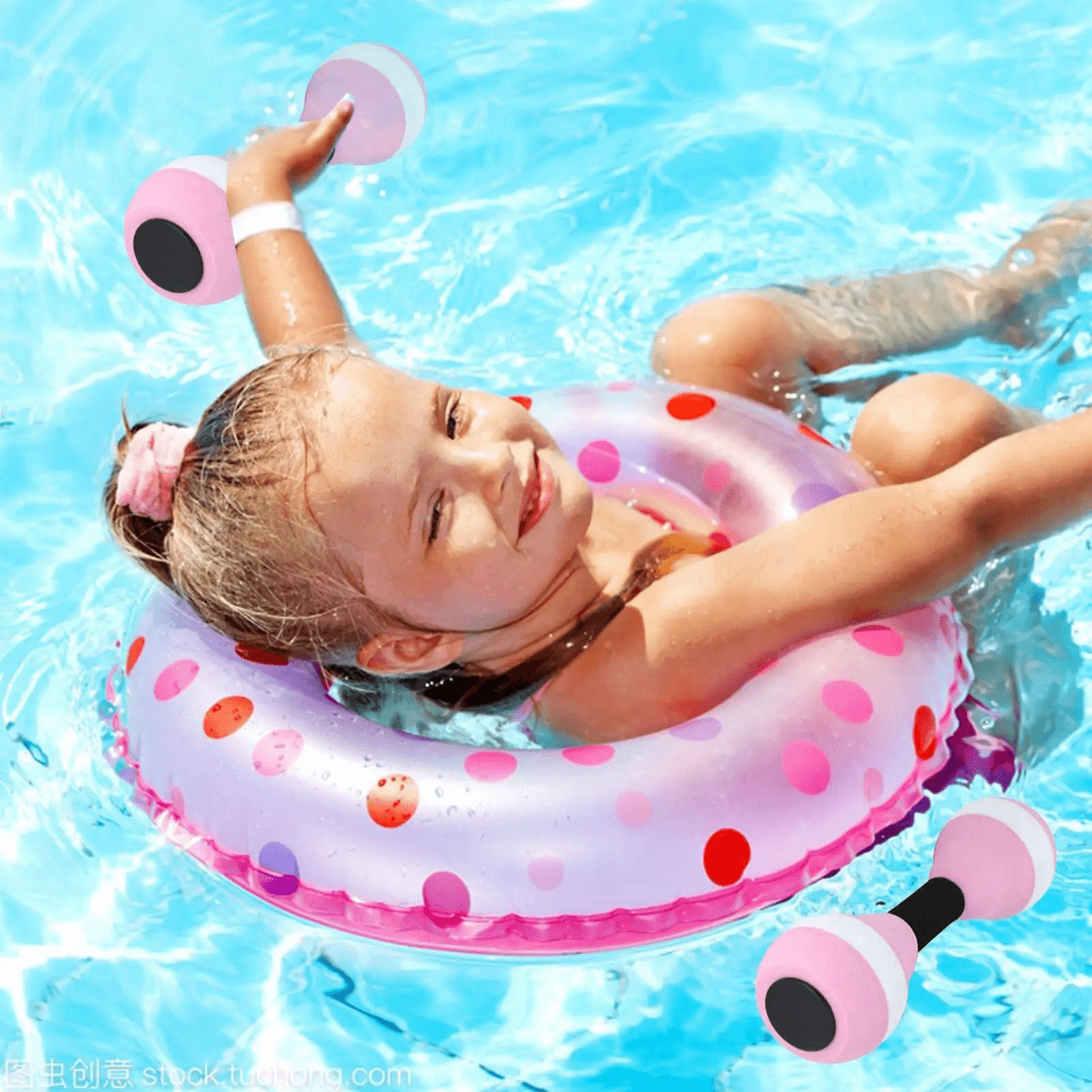 Child enjoying pool time with EVA foam aquatic dumbbells, floating with a colorful inflatable ring.