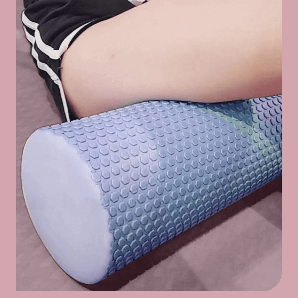 Hexagonal EVA foam yoga roller used for muscle relief and stretching in Pilates.