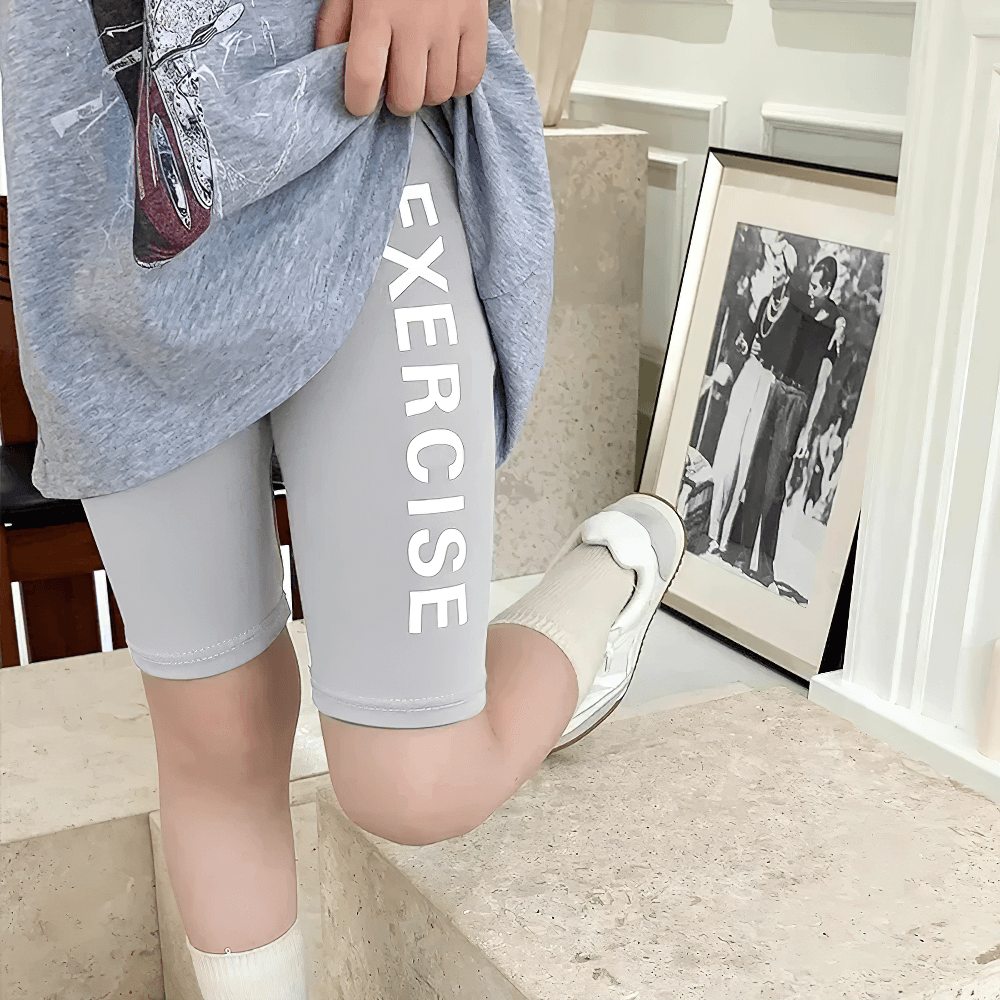 Child wearing Exercise Print Stretch Biker Shorts for Active Wear - SF3758, showcasing bold lettering and sporty style.