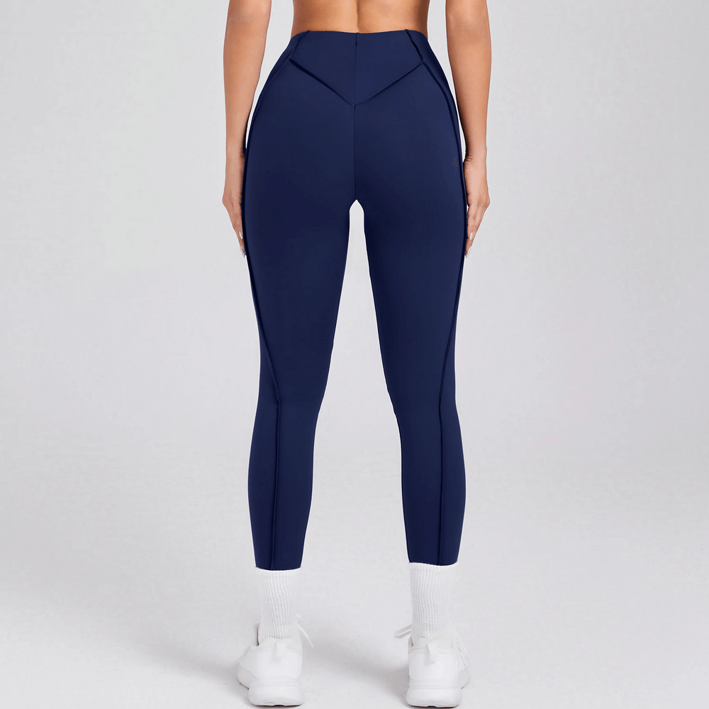 Back view of Exposed Seam High Waist Yoga Leggings - SF4056 in navy, showing unique seam design and snug fit ideal for gym sessions.