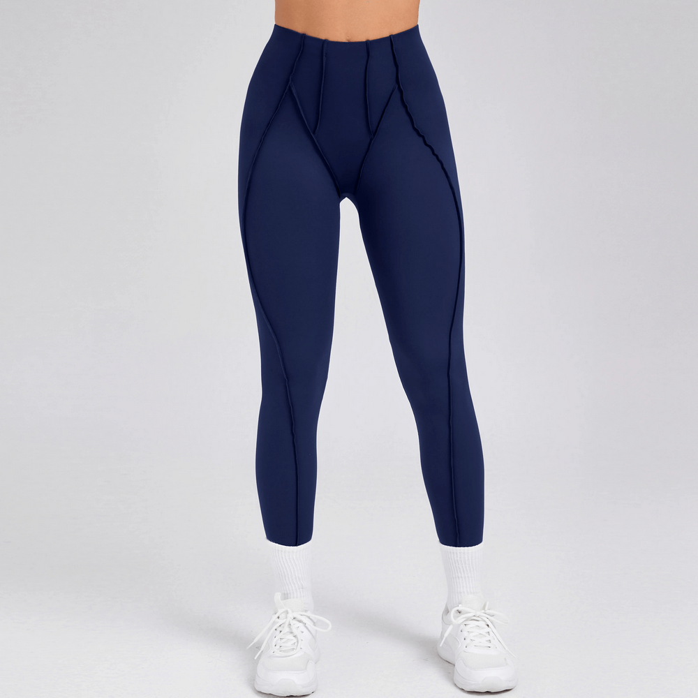 Woman wearing navy Exposed Seam High Waist Yoga Leggings - SF4056 for gym workouts and pilates.