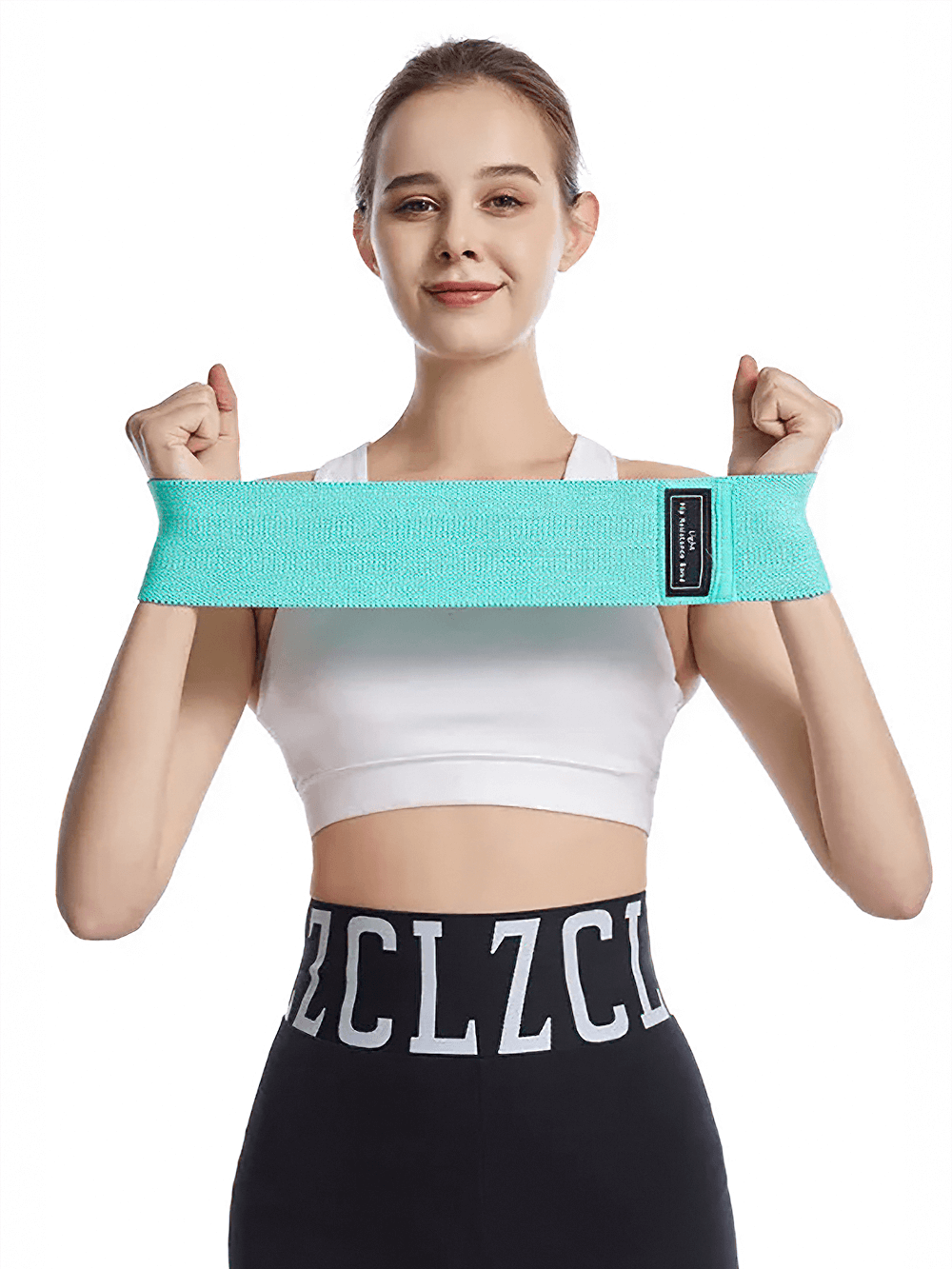 Woman demonstrating non-slip fabric resistance band for glute training, ideal for yoga and fitness workouts.