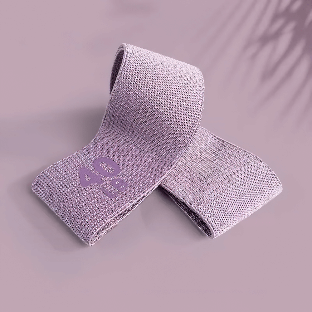 Purple fabric resistance band labeled 40 LB, ideal for home gym workouts and Pilates.