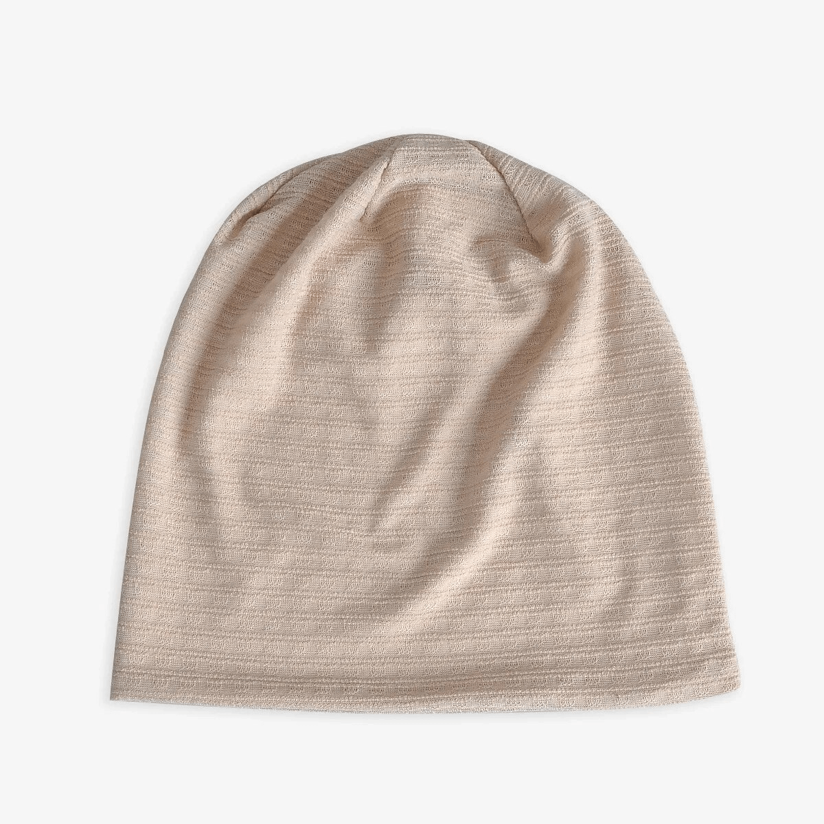 Fashion baggy solid beanie for women or men, unisex cotton-polyester blend in beige. Stylish one-size fits all accessory, SF1741.