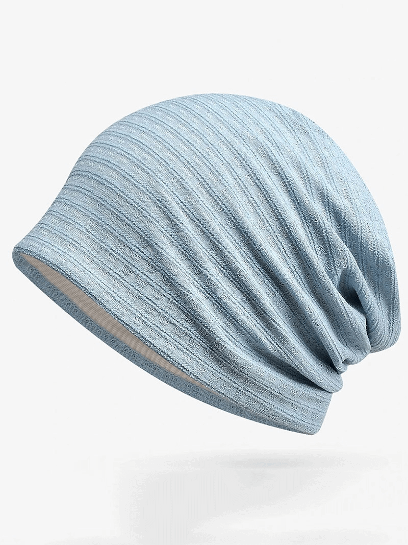 Light blue baggy solid beanie for men and women, made with quality cotton and polyester, offering warmth and style, one size fits all.