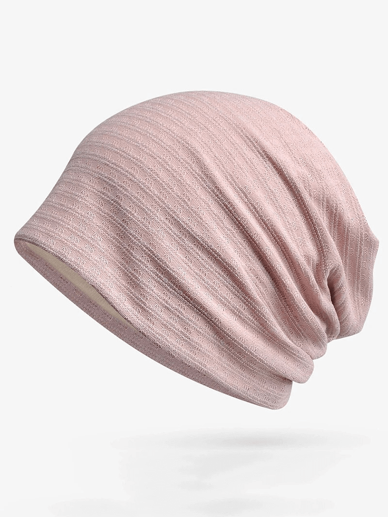 Unisex fashion baggy solid beanie in soft pink, perfect for any wardrobe, made with quality cotton and polyester for warmth.