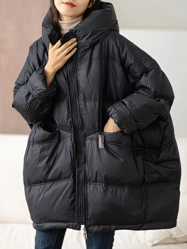 Alt Tag: Fashion casual women's oversized black down jacket with hood, featuring pockets and full-length zipper for winter warmth.