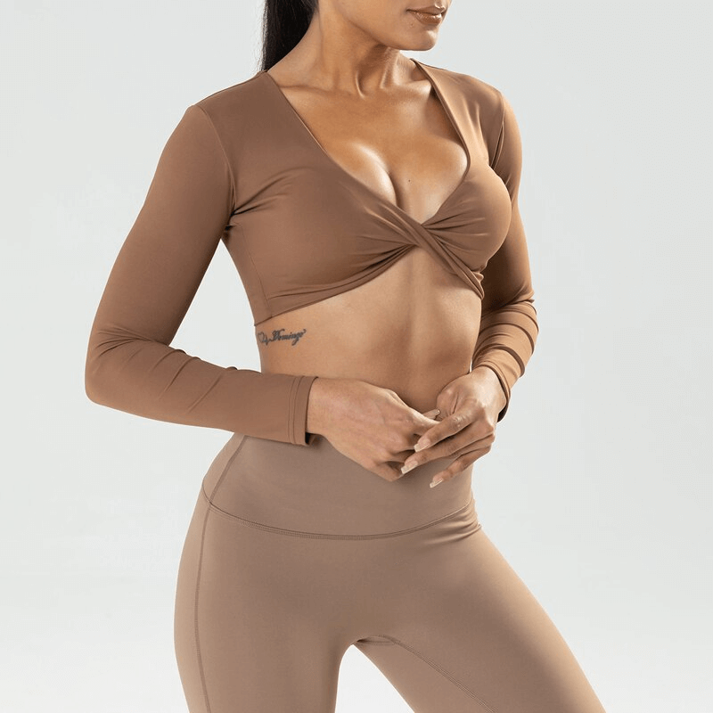 Woman wearing a Fashion Cropped Sporty Women's Long Sleeves Top in brown, perfect for yoga or workouts.