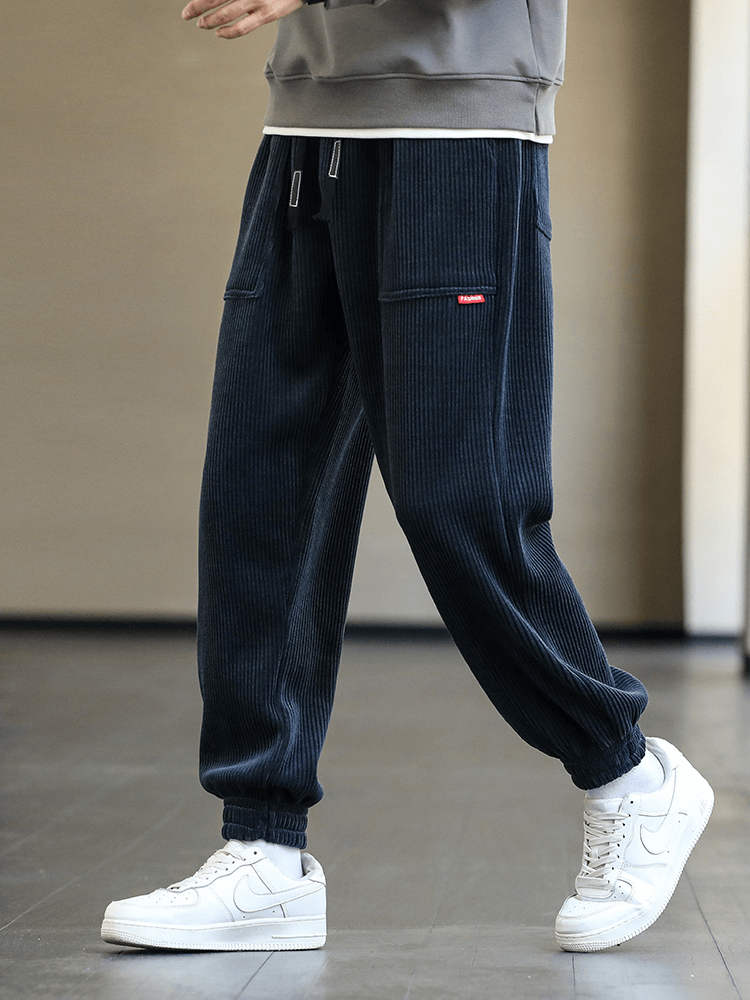 Fashion Elastic Hem Corduroy Sweatpants for Men, Loose Casual Joggers, stylish and comfortable with drawstring and pocket design.
