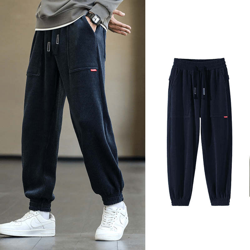 Men's fashion elastic hem corduroy joggers, loose casual style, black, featuring drawstring and pocket accents for comfort and style.