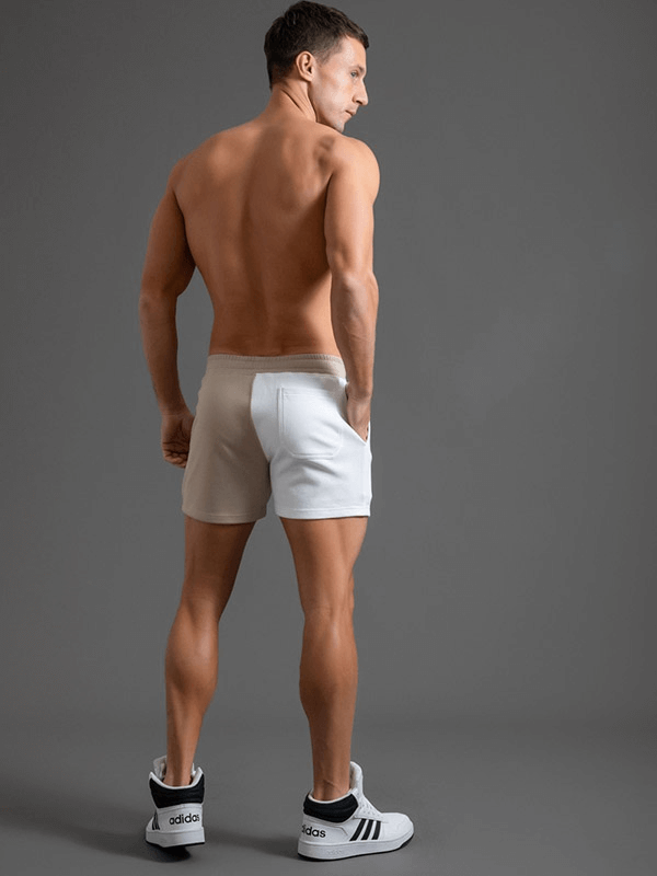 Back view of a man wearing fashion elastic waist cotton two-color shorts for men, showcasing a stylish and comfortable fit.