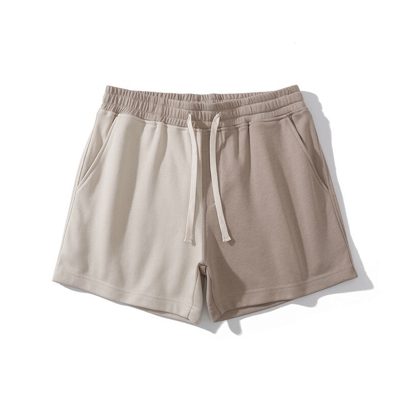 Fashion elastic waist cotton two-color men's shorts with drawstring and pockets, ideal for casual wear and sporting activities.