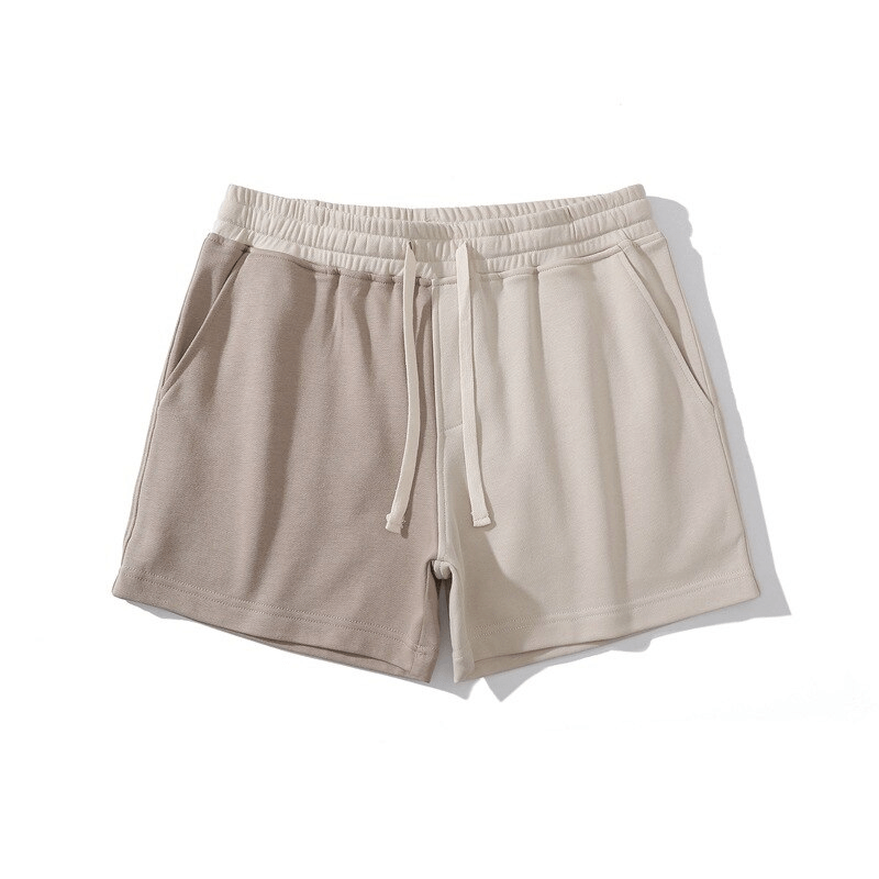 Men's two-color shorts SF1394 with elastic waist and pockets, featuring a stylish patchwork design in breathable cotton, perfect for sports.