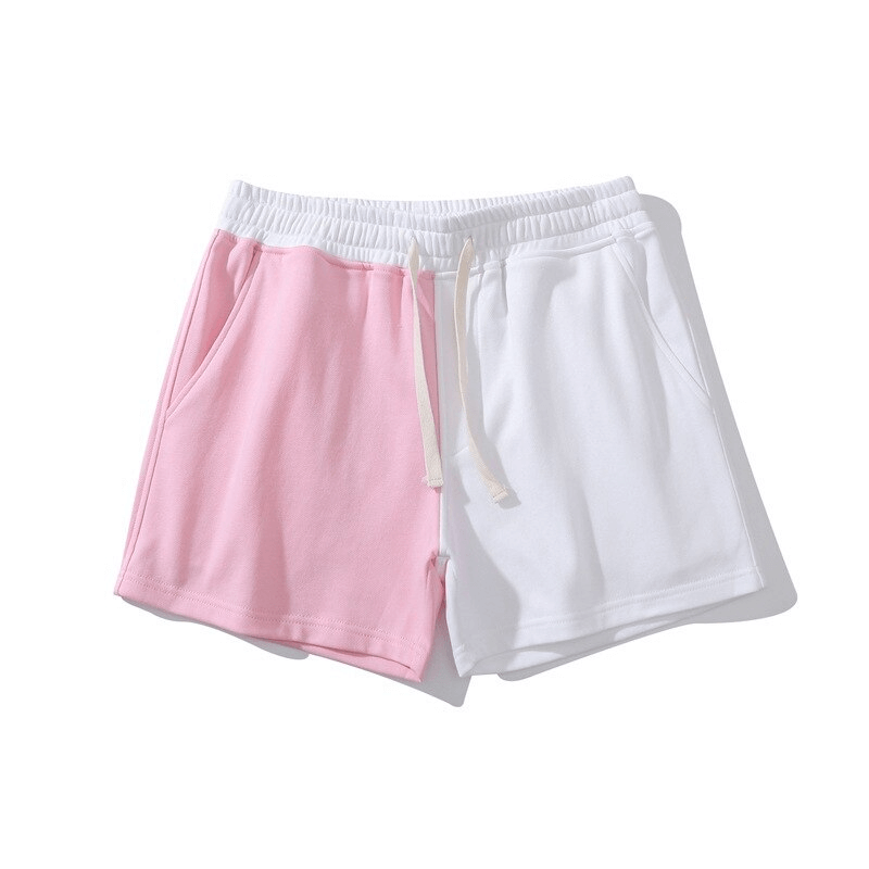 Men's fashion two-color shorts in pink and white with elastic waist and pockets, made of breathable cotton for sporty comfort.