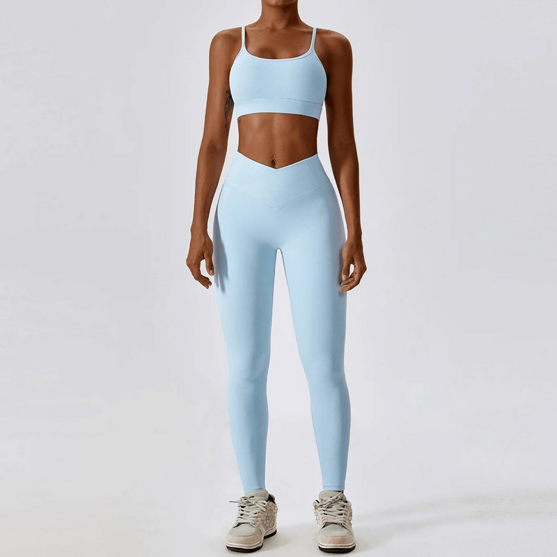 Woman wearing a blue 2-piece seamless sports set with leggings and top, perfect for fitness and activewear. Stylish and functional attire.