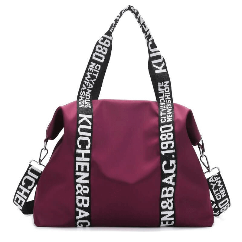 Purple lightweight yoga handbag for women with bold straps, ideal for gym, travel, and sports, made from durable nylon material.