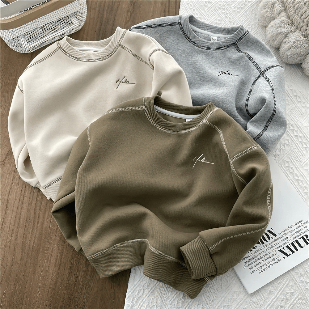 Fashion Loose Crewneck Cotton Pullover for Kids - SF3531 in beige, olive, and gray colors, laid out on a table for display.
