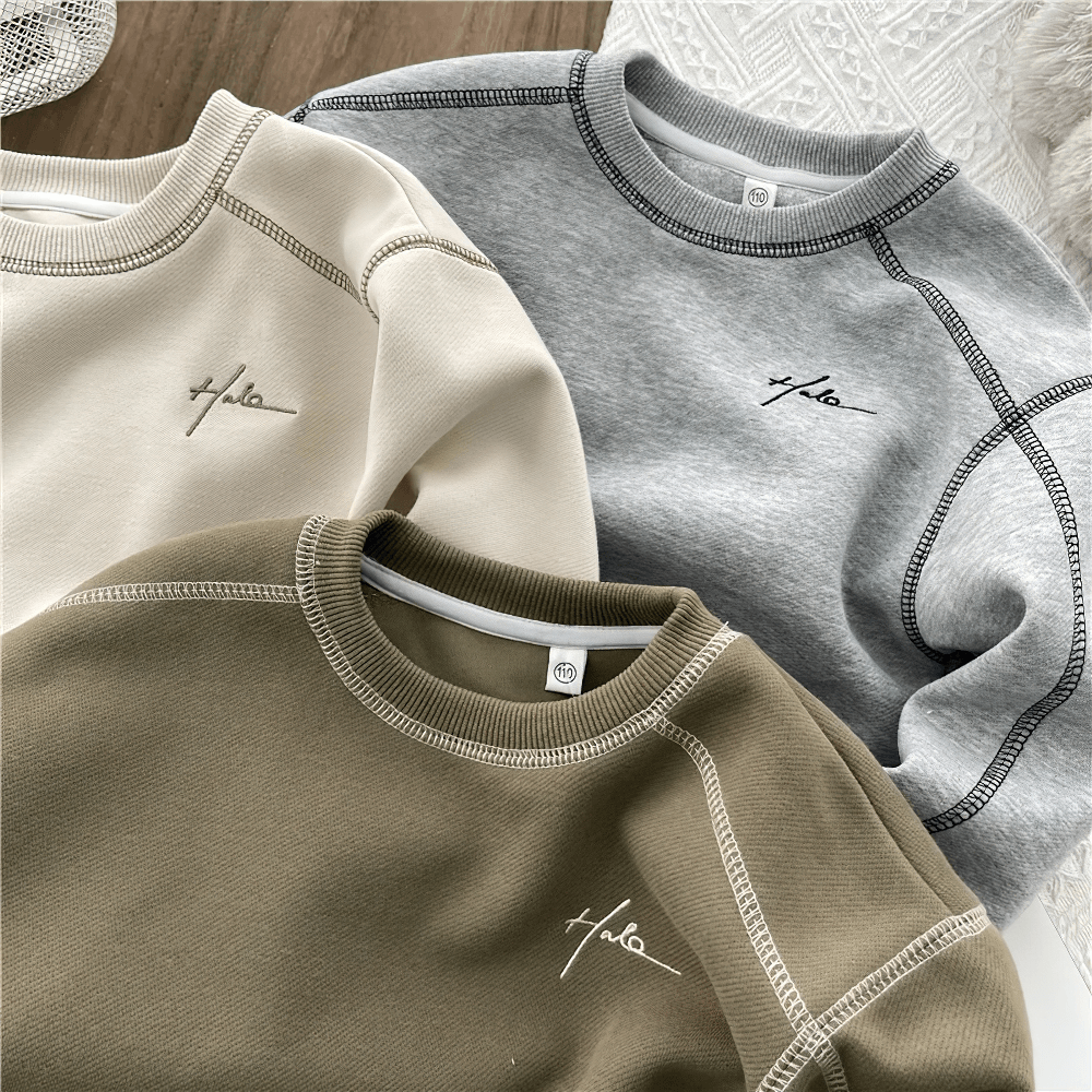 Fashion Loose Crewneck Cotton Pullover for Kids - SF3531 displayed in beige, grey, and olive green on a wooden background.