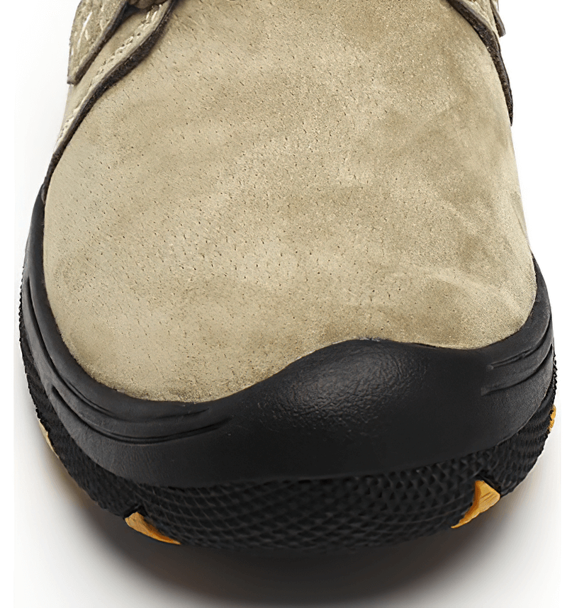 Close-up of Fashion Male Breathable Genuine Leather Shoes with sturdy rubber outsole, perfect for outdoor trekking.