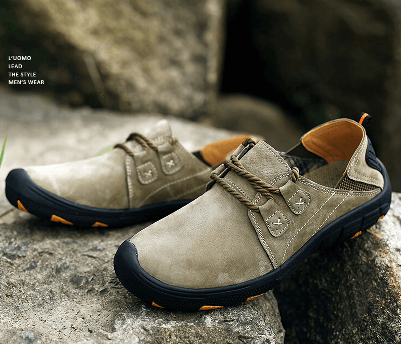 Fashionable breathable leather trekking shoes for men with lace-up closure and sturdy outsole, perfect for outdoor adventures.