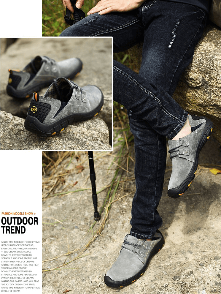 Man wearing breathable genuine leather trekking shoes, sitting outdoors on rocks, showcasing stylish, durable footwear.