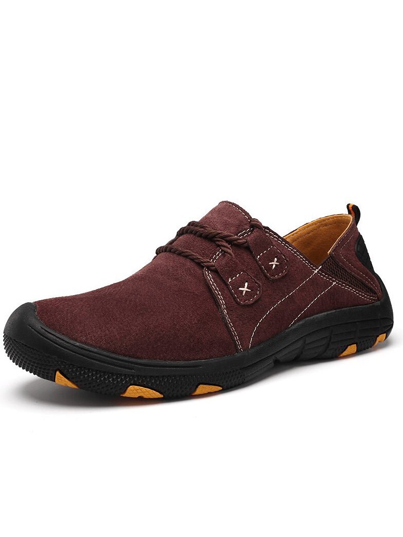 Fashionable breathable leather shoes for men, perfect for outdoor trekking. Featuring lace-up design, rubber outsole, and secure fit.