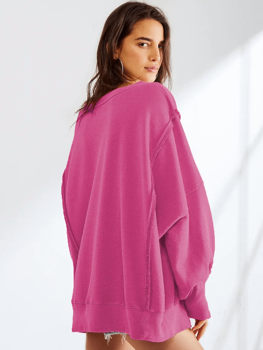 Fashionable pink drop-shoulder loose sweatshirt for women, featuring a casual O-neck and three-quarter sleeves, SF1582 model.