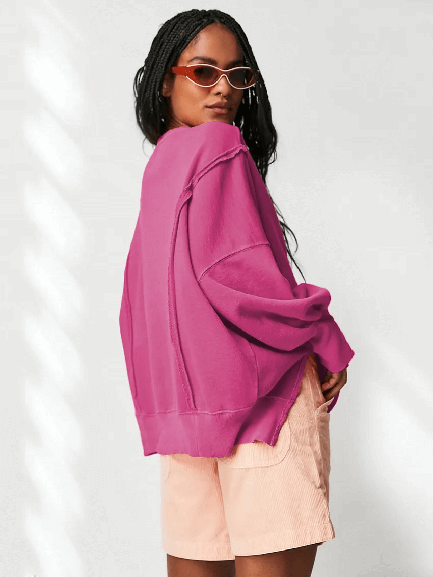 Woman in loose fit solid color drop-shoulder sweatshirt, wearing sunglasses and shorts, showcasing casual style for women - SF1582