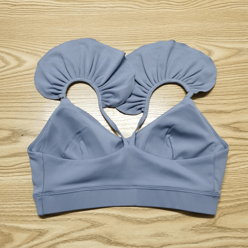 Solid color elastic sports bra for women, perfect for yoga and running, made of breathable quick-dry nylon for comfort and coverage.