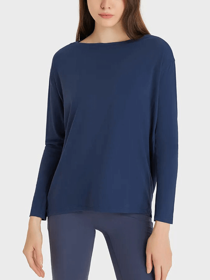 Navy blue long sleeves gym top made of nylon and spandex, featuring loose fit and breathable fabric, ideal for workout comfort.