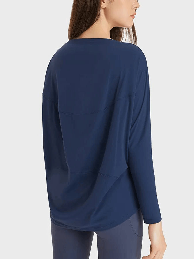 Back view of woman wearing navy solid color long sleeves loose top for gym, made of quick-drying, anti-pilling fabric.