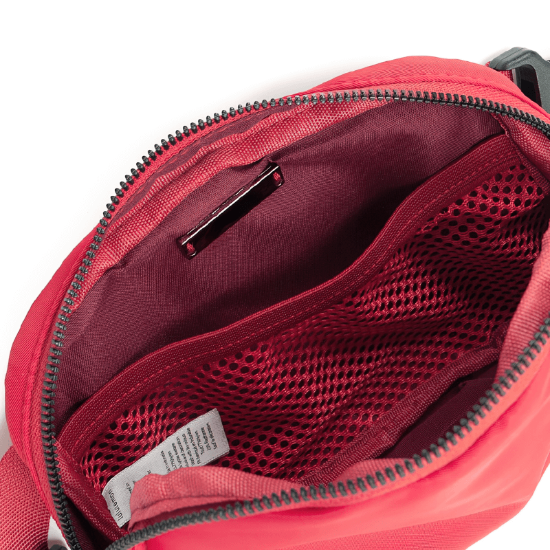 Interior view of a red fashion sports waist bag with zipper pocket and mesh organizer, perfect for running. Model SF1511, unisex style.