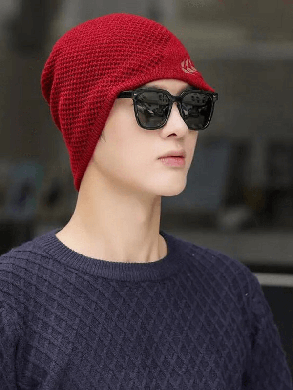 Unisex fashion warm knitted ski beanie with wheat ear pattern, worn outdoors. Stylish and cozy polyester beanie for winter activities.