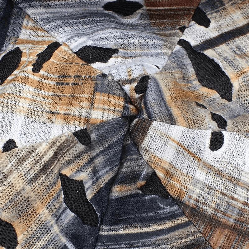 Geometric pattern on a warm polyester beanie, featuring a mix of earthy tones and stylish hole designs, perfect for casual fashion.