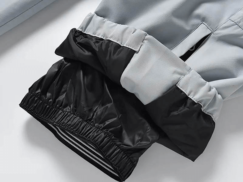 Close-up view of fashion warm windproof and waterproof snowboarding pants, highlighting zipper and broadcloth fabric details.