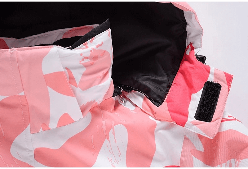 Close-up of the fashion women's waterproof jacket with pink print, showcasing its hooded collar for optimal winter protection, SF1782.