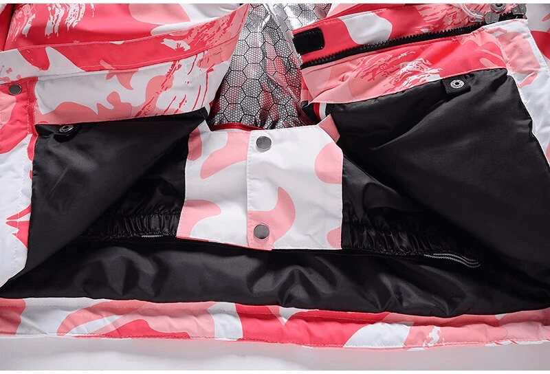 Detailed view of women's waterproof jacket interior, showcasing stylish print and secure snap closures for winter activities.