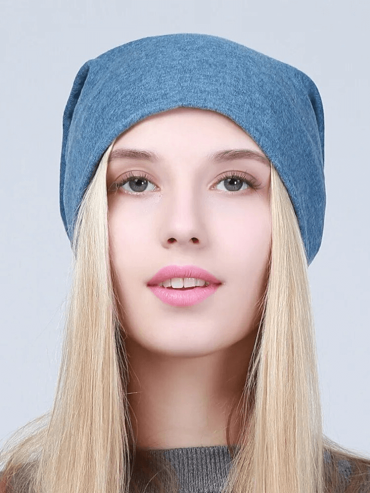 Stylish woman wearing a blue cotton casual beanie, perfect for any casual setting, providing warmth and fashionable flair.