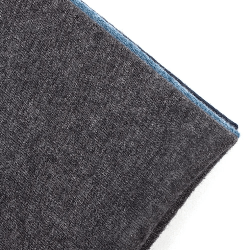 Close-up of a fashionable cotton casual women's beanie in solid grey and blue, showcasing its textured cotton blend material.