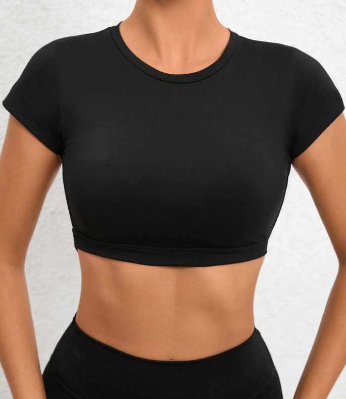 Fashionable black cropped women's top with short sleeves and open back, perfect for yoga, made from quick-drying elastic nylon.