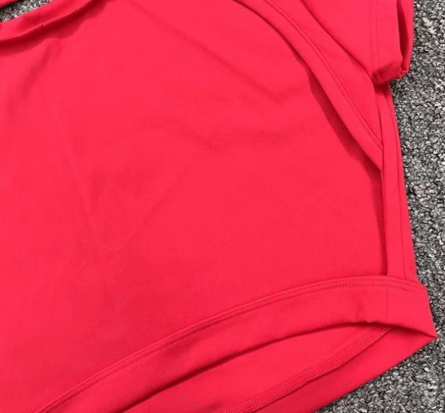 Bright red fashionable elastic cropped women's open back top perfect for yoga, featuring short sleeves and durable nylon fabric.