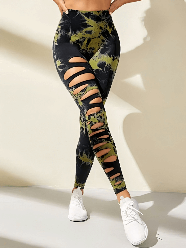Model wearing fashionable elastic tight women's leggings with stylish cutouts, high-waisted fit, and ankle-length design.