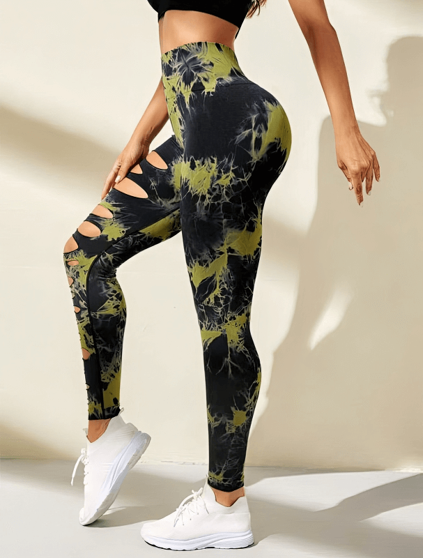 Fashionable high-waisted women's leggings with stylish cutouts, made from elastic nylon fabric, perfect for active wear and comfort.