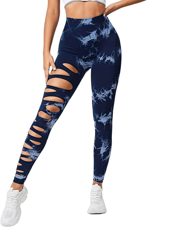 Model wearing stylish high-waisted women's cutout leggings, navy blue with abstract patterns, perfect for activewear and fashion.