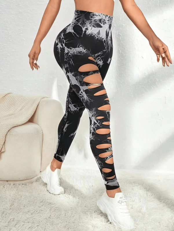 Fashionable elastic tight women's leggings with stylish side cutouts, high-waisted fit, ankle-length, in breathable nylon fabric.