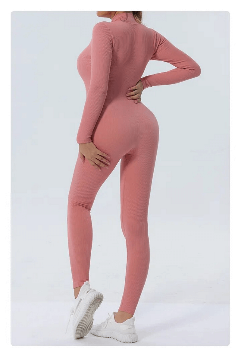 Back view of women's seamless pink zip-up bodycon jumpsuit for fitness with anti-pilling technology. Ideal for yoga and training.