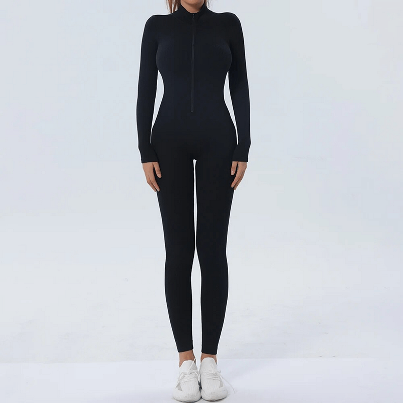 Woman wearing a black seamless zip-up bodycon jumpsuit designed for training and fitness, featuring nylon material for comfort.