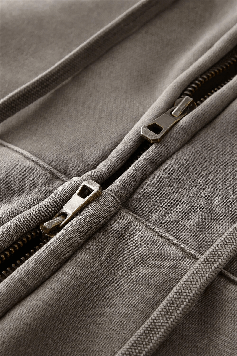 Close-up of a fashionable women's fleece hoodie zipper showing detailed stitching, perfect for breezy evenings and casual outings.